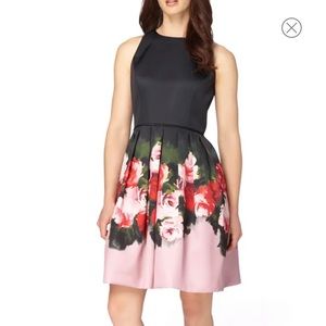 Tahari black/floral cocktail dress with pockets.